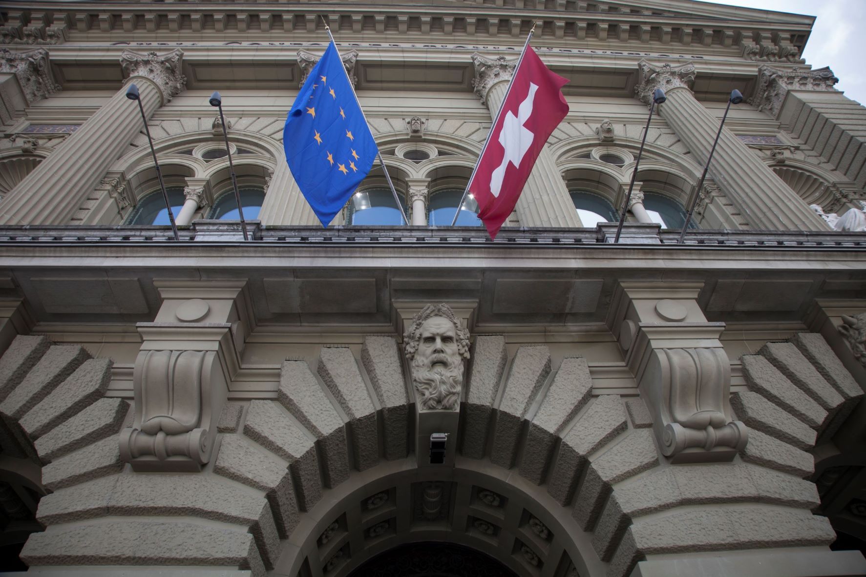 The flags of Switzerland and the European Union.
