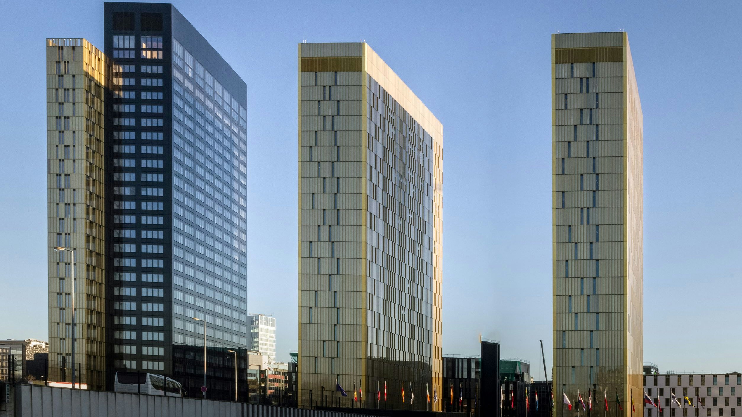 The Court of Justice of the European Union in Luxembourg with its golden towers shimmering against a blue sky.